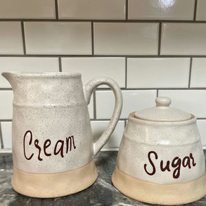 Pfaltzgraff Cream and Sugar Stoneware Set of 2 Natural Colors Brown Lettering